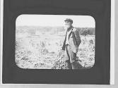 Man in harvested field
