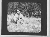 Charles Newhall on a log, Wyoming Trip