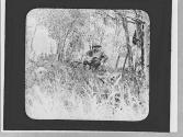 Man sitting in a folding chair, Wyoming Trip