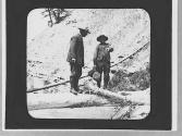 Men on a log, Wyoming Trip