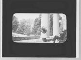 Man on porch of Otesaga Hotel, Cooperstown Trip