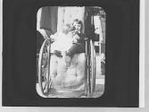 Dryden children in Maria Eastman's wheelchair