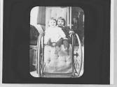 Dryden children in Maria Eastman's wheelchair