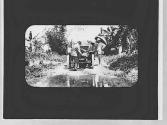 People unloading Eastman's 1907 Packard, Jamaica Trip