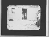 Native American woman & children in doorway, Arizona Trip