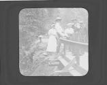 George Eastman and guests watching lady fire gun, Oak Lodge Trip