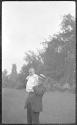 GE holding Dryden? child in garden