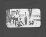 George Eastman and men talking in yard, Oak Lodge Trip