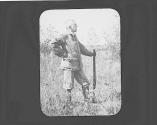Walter Hubbell standing in field, Oak Lodge Trip