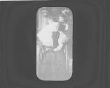 Dryden children posing with Maria Eastman in her wheelchair