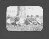 George Eastman and friends sitting on ground, Oak Lodge Trip