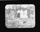 George Eastman and guests inspecting cornerstone of cabin, Oak Lodge Trip