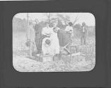 George Eastman and guests inspecting cornerstone of cabin, Oak Lodge Trip