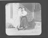 Anna Hubbell and Mary Mulligan dancing on porch, Oak Lodge Trip
