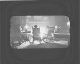 George Eastman and friends in front of fire, Oak Lodge Trip