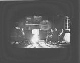 George Eastman and friends in front of fire, Oak Lodge Trip