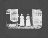 Two women standing in doorway