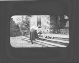 Woman on porch with printing frames, Oak Lodge Trip