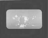 George Eastman and friends sitting around fireplace, Oak Lodge Trip