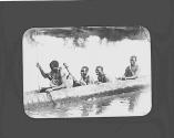 Native men in canoe
