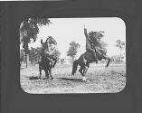 Men on rearing horses