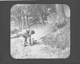 William Carter tending campfire, Petersham Motor Trip