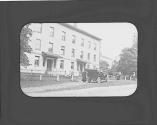 Automobile in front of city house, Petersham Motor Trip