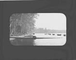 Woman sitting on dock, Petersham Motor Trip