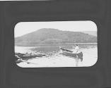 Woman in canoe on lake, Adirondacks Trip