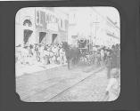 Flower covered carriage in city street