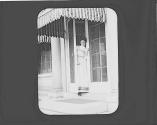 Nell Newhall in doorway