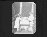 Ellen and George Eastman Dryden with Watson Newhall in Eastman's garden