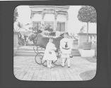 Dryden children with Watson Newhall in Eastman's garden