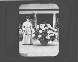 Cordelia Eastman standing next to hydrangea