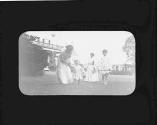 Women and children in garden