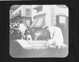 Children and maid in garden