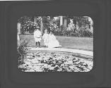 Ellen Maria Dryden and Watson Newhall with woman by pond