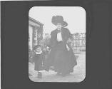 Woman with child walking in garden
