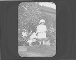 Ellen Maria Dryden with doll carriage in garden