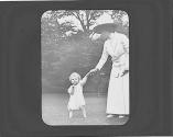 Woman with child on lawn