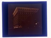 [Building lit at night]