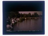 [People along waters edge]