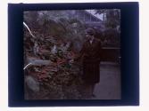 [Woman in conservatory/greenhouse]