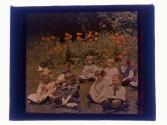 [Children sitting on ground]