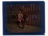 [Man in costume on horse]