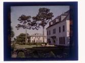 [Two large white houses]