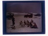 [Unid. group on beach]