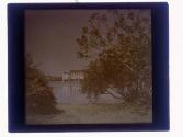 [Landscape with water, hotel in background]