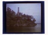 [Stone building on water]
