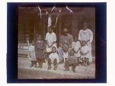 [African American family on porch]